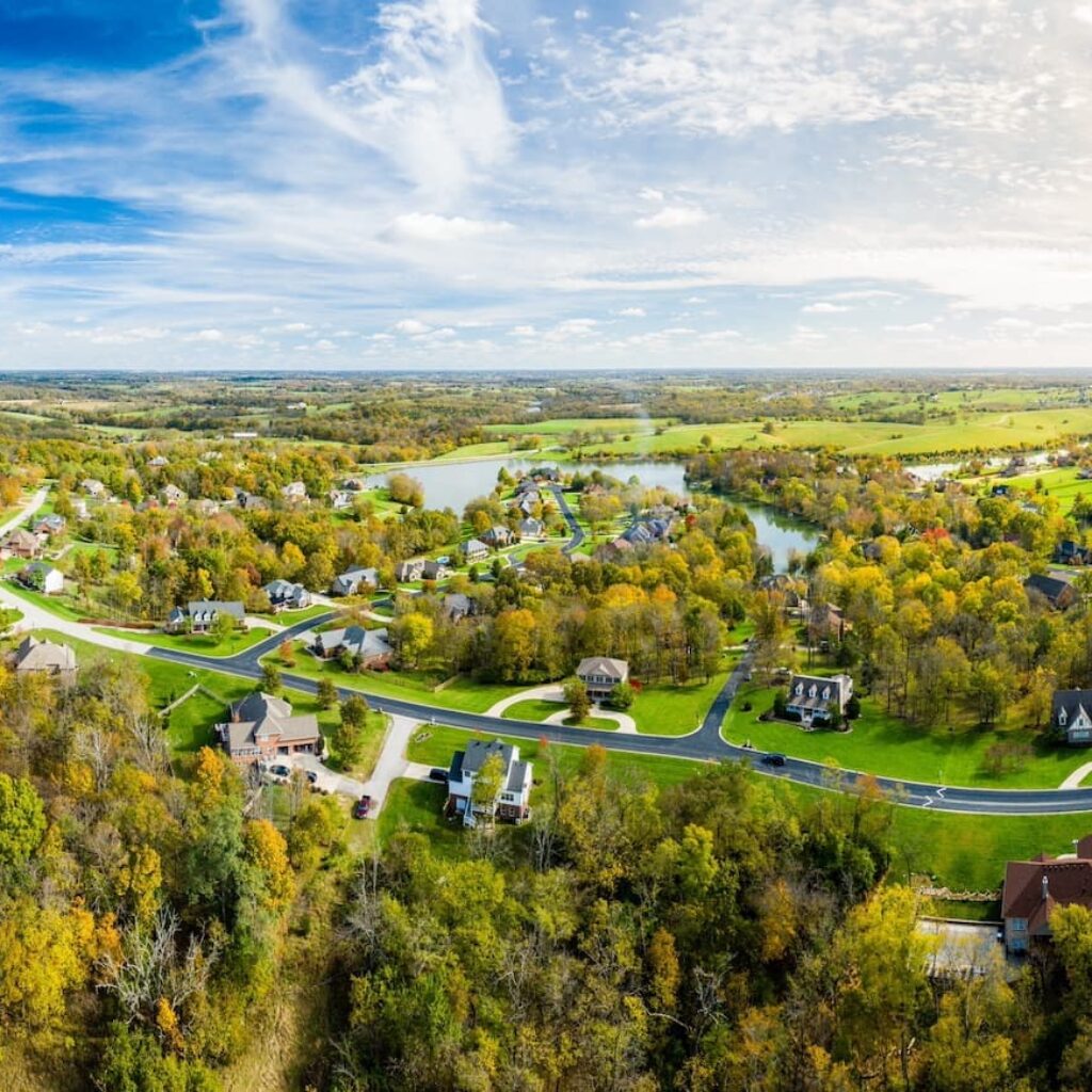 overview of homes amid trees and near a lake in madison county kentucky