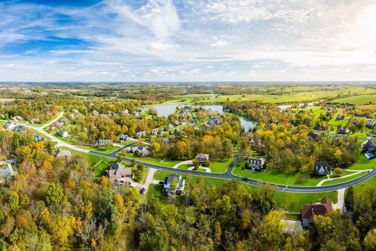 overview of homes amid trees and near a lake in madison county kentucky