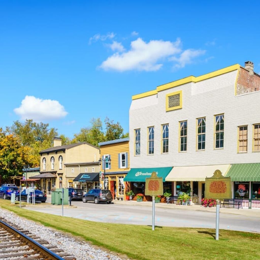 a street with shops near a railroad track in woodford county kentucky