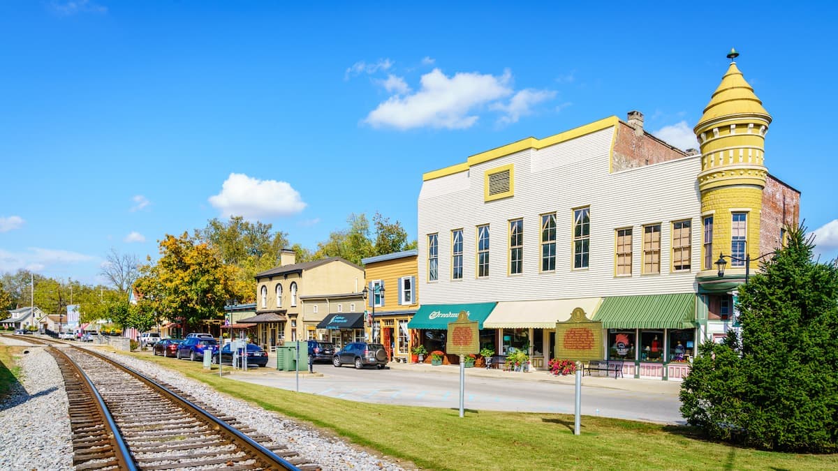 a street with shops near a railroad track in woodford county kentucky